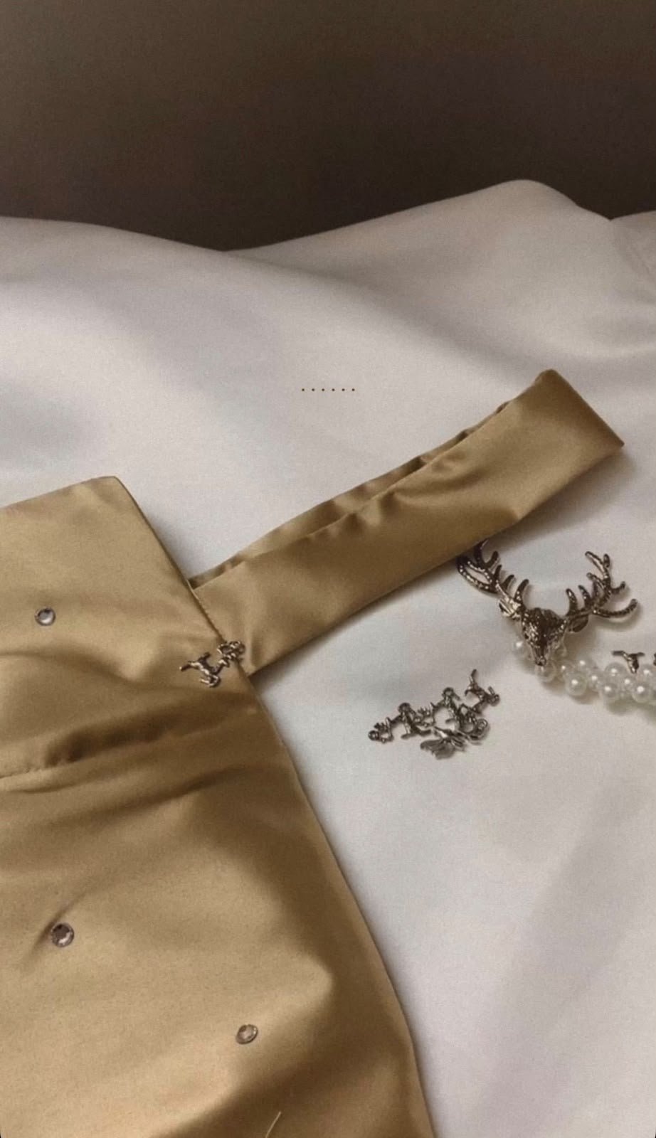 Gold satin fabric and embellishments